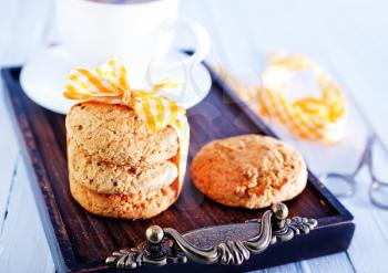 cookies and tea in cup and on a table