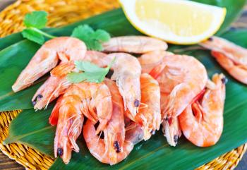 shrimps and lemon on the wooden table