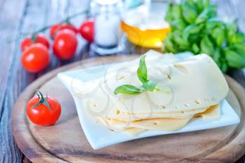 cheese on plate and on a table