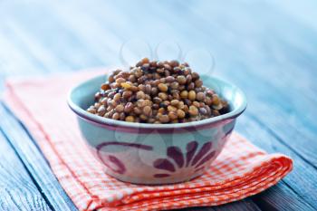 lentil in bowl and on a table