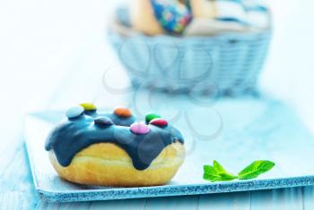 donuts on plate and on a table