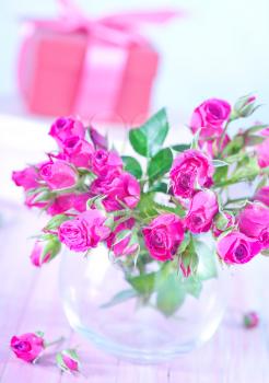 flowers in vase and on a table