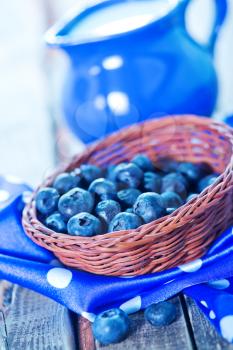 blueberry in basket and on a table