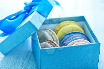 color macaroons in the box and on a table