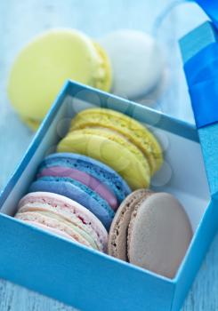 color macaroons in the box and on a table