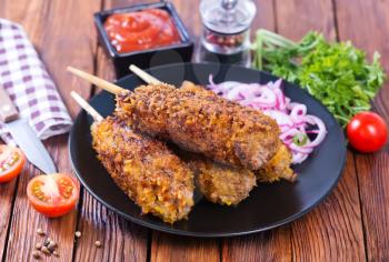 fried kebab with spice and fresh tomato