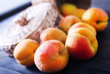 fresh peaches on the wooden table, fresh fruits