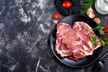 raw meat with spice and salt on a table