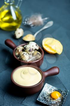 mayonnaise in bowl and on a table