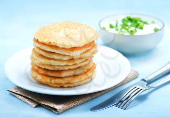 potato pancakes on plate and on a table