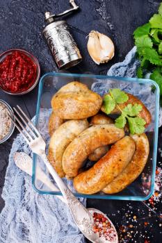 friedsausages in bowl, fried chicken sausages with spice