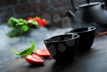 Tea with fresh basil and strawberry, fresh herbal tea