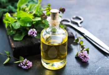 herbal oil in bottle and on a table