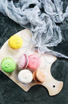 color macaroons on board and on a table