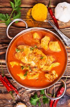 Traditional Indian dish chicken. Spicy chicken curry in bowl 