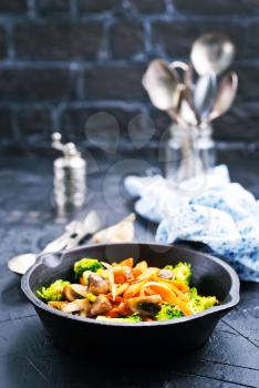 fried mushrooms with vegetables, fried vegetables in pan