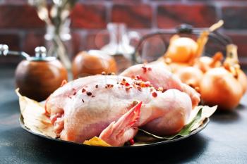 raw chicken and spice on a table, stock photo