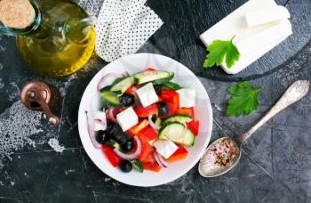 greek salad in white bowl, vegetables and feta
