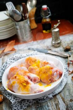 raw chicken legs with aroma spice and salt