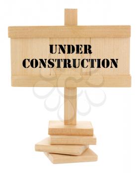 Under construction wooden tablet isolated on white
