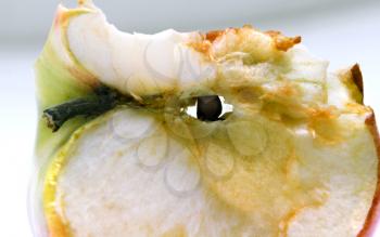Strange eaten apple in the shape of an eye close up