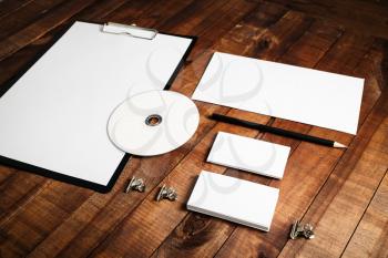 Blank stationery set. Corporate identity template on vintage wooden table background. Mock-up for design presentations and portfolios.