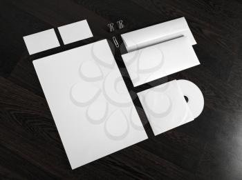 Blank stationery and corporate id template on wooden background.