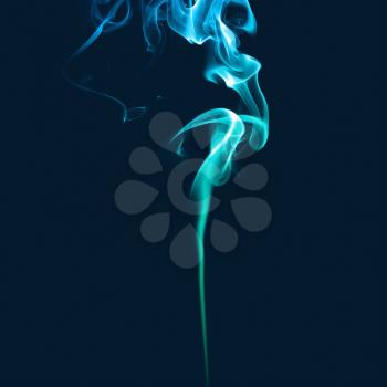 Blue smoke. Abstract bright colored smoke on a dark background.