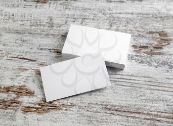 Mockup of blank business cards stacks on wooden table background. Template for your design.