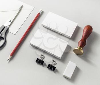 Photo of blank stationery set on paper background. Responsive design mock-up for placing your design. ID template. Top view.