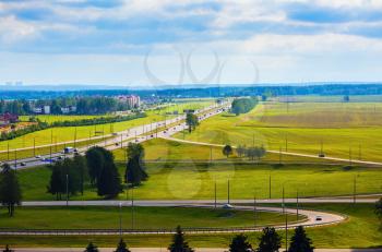 Summer landscape with green fields and roads. Minsk region, Belarus.