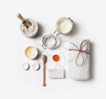 Spa wellness products and toiletries on white paper background. Flat lay.