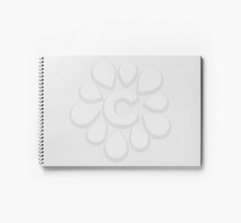 Photo of blank sketchbook or album for drawing on white paper background. Responsive design template. Free space. Top view. Flat lay.