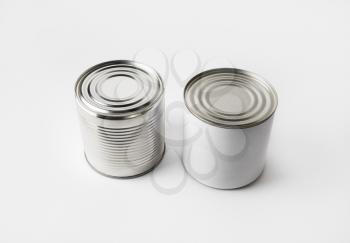 Two blank food tin cans. Responsive design mockup.