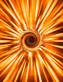 Vertical orange spiral rays swirl abstraction background