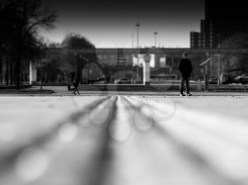 Low angle black and white city street bokeh background