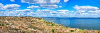 Ancient greek colony Olbia on the banks of the Southern Bug River in Ukraine on a cloudy summer day. Hi-res panoramic photo.