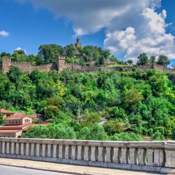 Tsarevets fortress with the Patriarchal Cathedral of the Holy Ascension of God in Veliko Tarnovo, Bulgaria. Big size panoramic view on a sunny summer day
