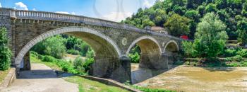 Bridge over the Yantra River near Veliko Tarnovo Fortress, Bulgaria. Hi res panoramic view on a sunny summer day.