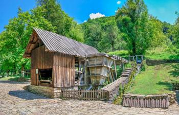Saw mill in the Etar Architectural Ethnographic Complex in Bulgaria on a sunny summer day. Big size panoramic photo.