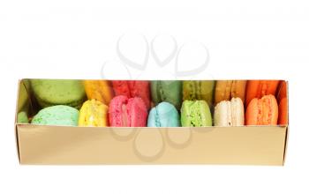 Colorful macaroons the golden box isolated on white background