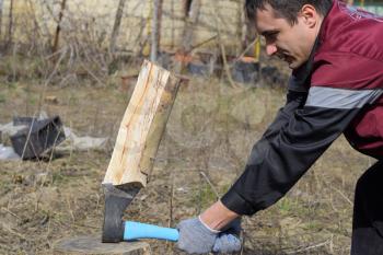 Chopping wood with an ax. Chopping wood