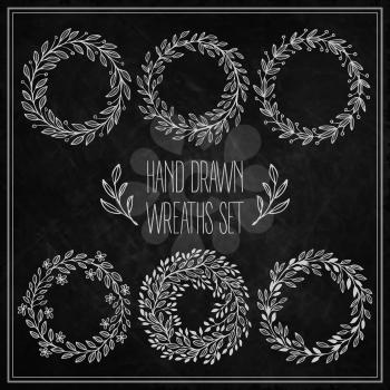 Set of decorative wreaths drawn in chalk on a blackboard. Vector illustration EPS 10