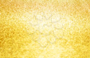 Gold background of glitter. New Year, Christmas, festive, magic defocused light