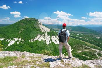 Man on the peak of mountain. Landscape composition. 