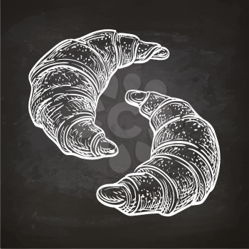 Vector illustration of croissants. Hand drawn sketch on chalkboard.