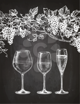 Set of wineglasses and grape vine. Red, white wine and champagne. Hand drawn sketch on chalkboard background.
