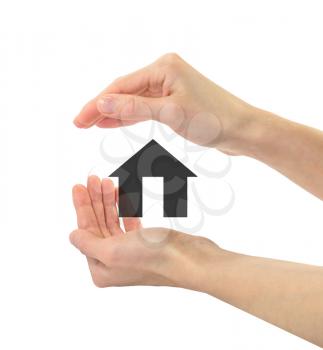 Real estate concept. Icon of an apartment house in human hands