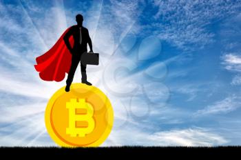 Male businessman standing on coin bitcoin. The concept of crypto currency in business