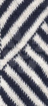 Beautiful knitted pattern with diagonal dark blue and white stripes.